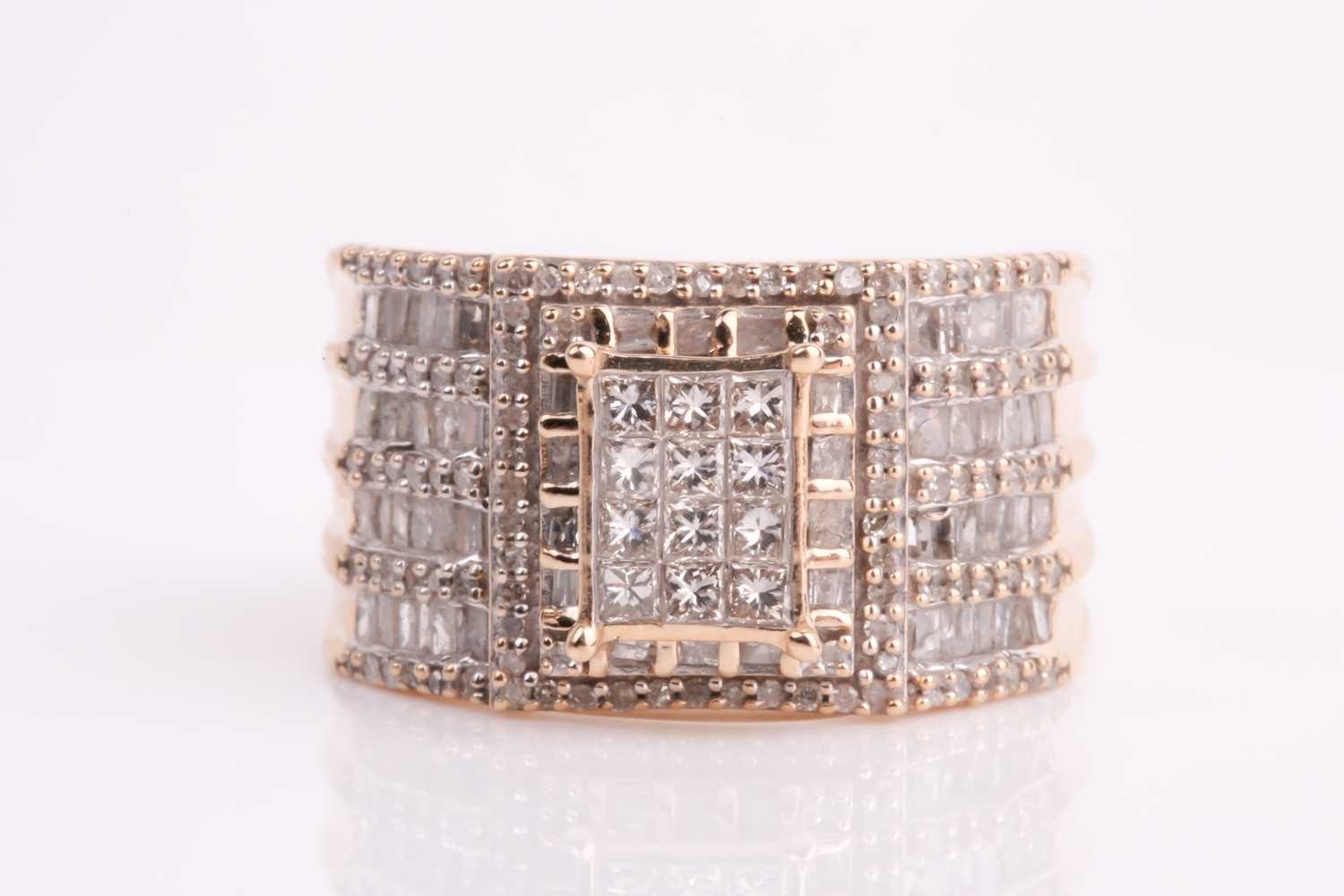 Lot 93 - A yellow metal and diamond ring, calibre-set...