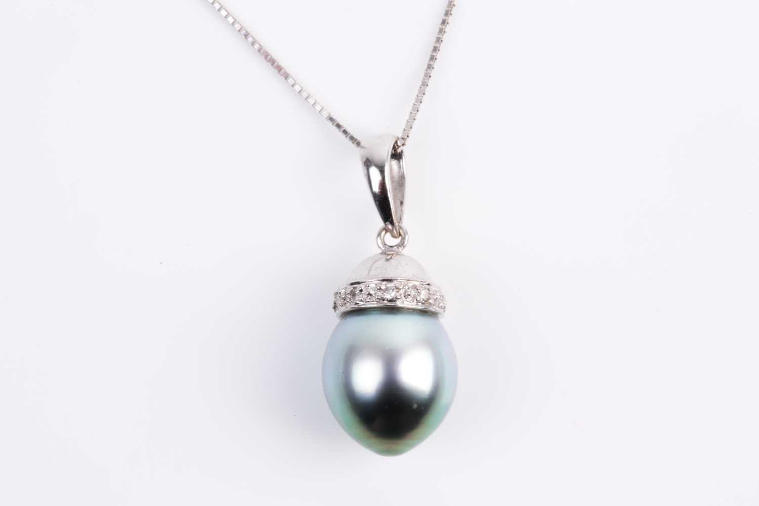 Lot 63 - A single stone Tahitian pearl and diamond...