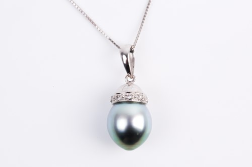 Lot 63 - A single stone Tahitian pearl and diamond...
