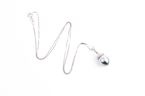 Lot 63 - A single stone Tahitian pearl and diamond...