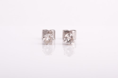 Lot 293 - A pair of solitaire diamond earrings of...
