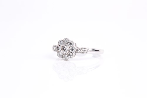 Lot 122 - A diamond cluster ring, the principle...