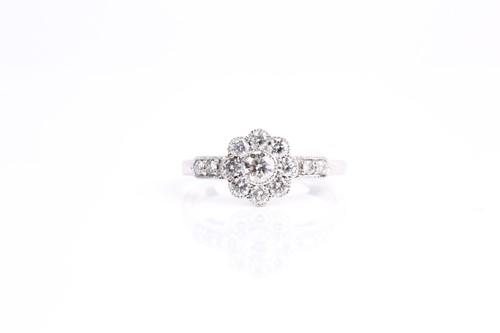 Lot 122 - A diamond cluster ring, the principle...