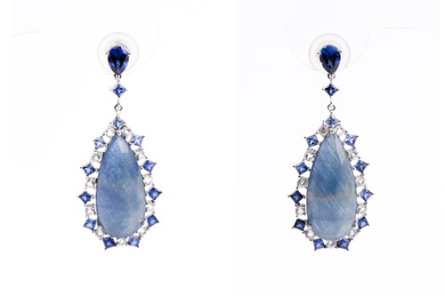 Lot 138 - A pair of sapphire pendant earrings, the...