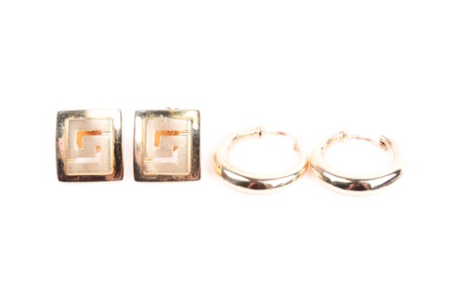Lot 428 - A pair of yellow metal earrings, of...