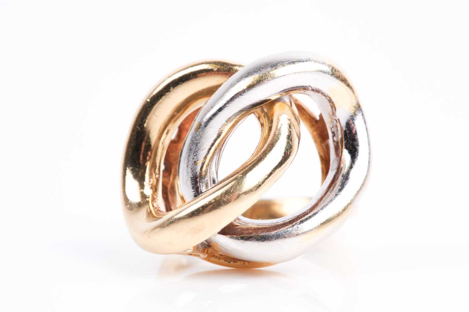 Lot 85 - A white and yellow metal ring, of stylised...