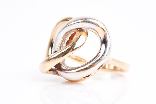 Lot 85 - A white and yellow metal ring, of stylised...