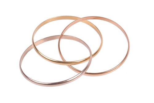Lot 339 - Cartier. A vintage 'Trinity' bangle, designed...