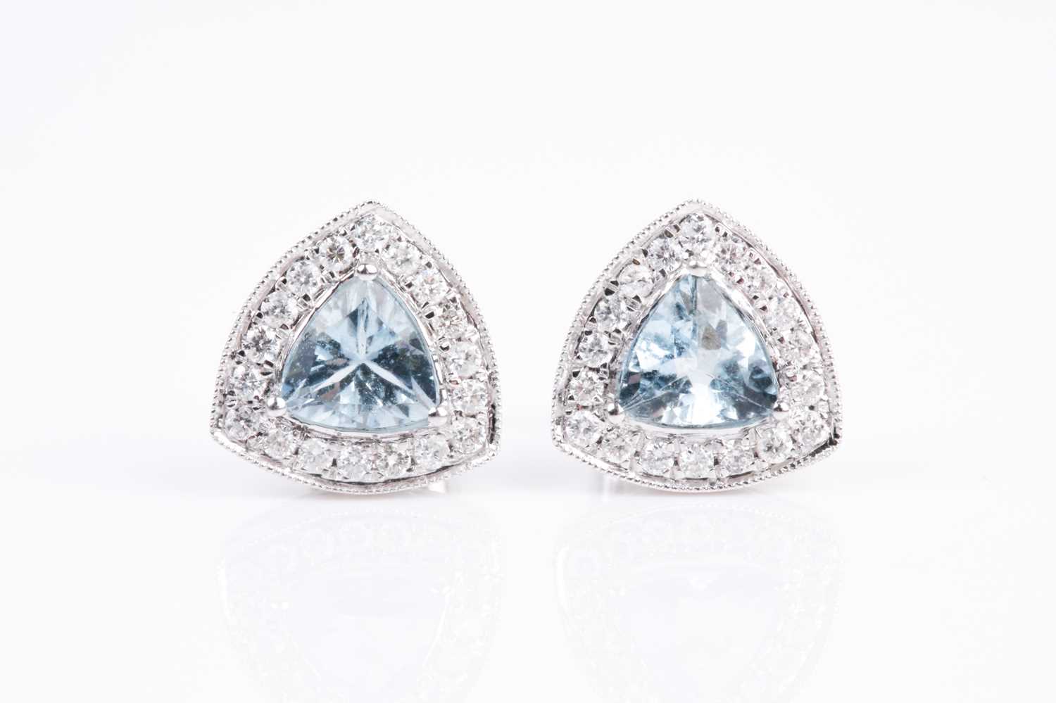 Lot 66 - A pair of 18ct white gold, diamond, and...