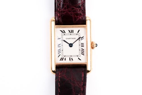 Lot 496 - A ladies Cartier Tank 18ct yellow gold quartz...