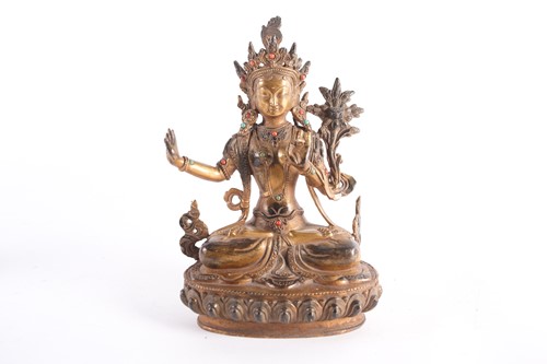 Lot 108 - A possibly Tibetan gilt bronze seated...