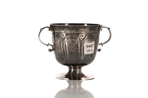 Lot 329 - A Charles II silver footed porringer, London...