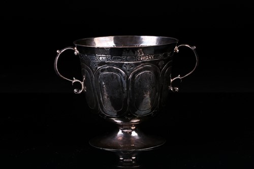 Lot 329 - A Charles II silver footed porringer, London...