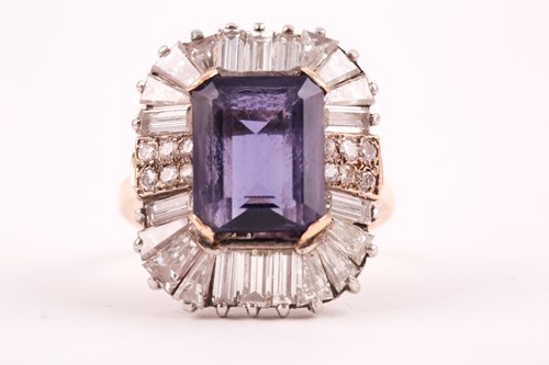 Lot 119 - A diamond and iolite dress ring, the step cut,...
