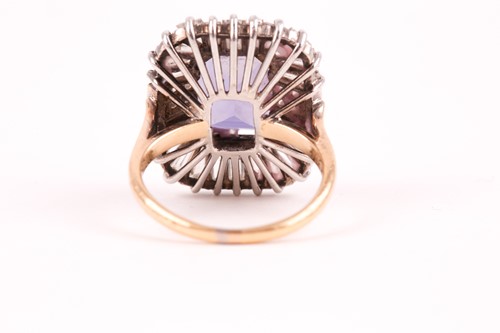 Lot 119 - A diamond and iolite dress ring, the step cut,...