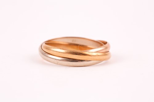 Lot 51 - A Cartier 'Trinity' three colour gold ring; in...