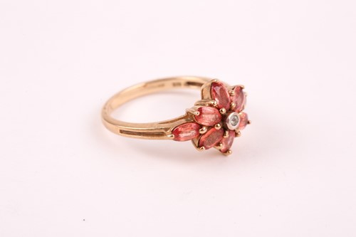 Lot 89 - An orange and white sapphire cluster ring, the...