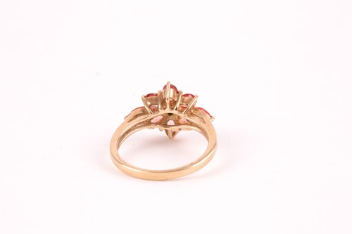 Lot 89 - An orange and white sapphire cluster ring, the...