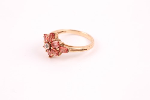 Lot 89 - An orange and white sapphire cluster ring, the...