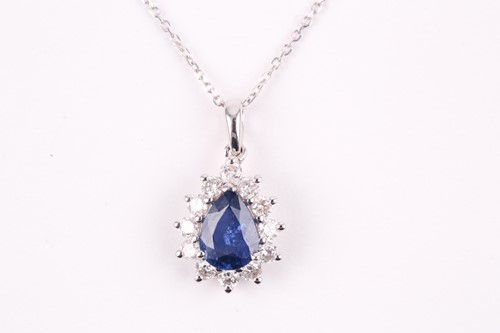 Lot 234 - An 18ct white gold, diamond, and sapphire...