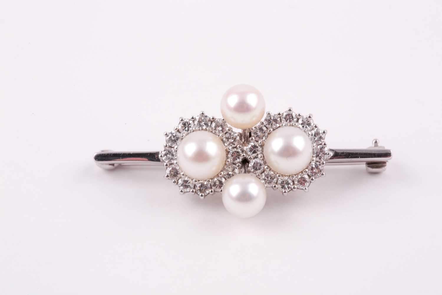 Lot 130 - A diamond and pearl quatrefoil cluster bar...