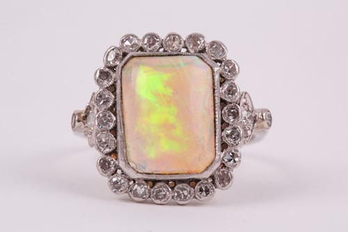 Lot 250 - A platinum, diamond, and opal cocktail ring,...