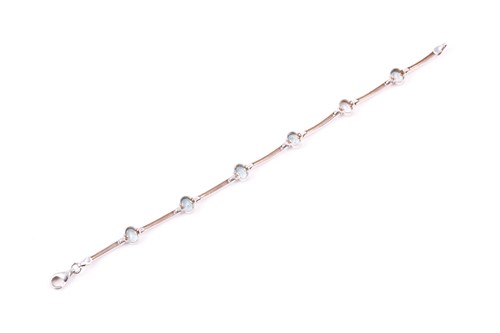 Lot 426 - A 9ct white gold and aquamarine bracelet, with...