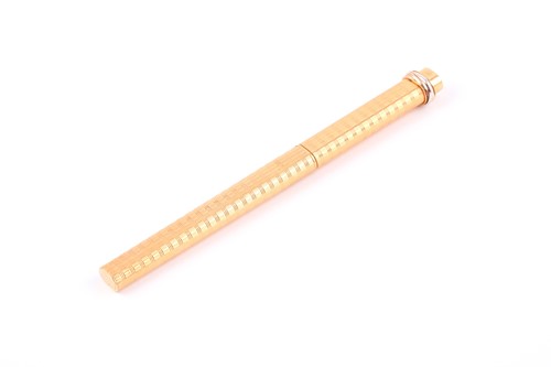 Lot 513 - Cartier, Paris. A gold plated ballpoint pen,...
