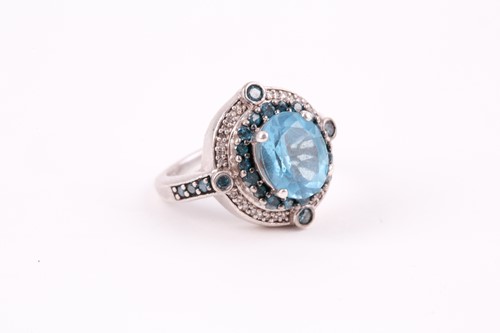 Lot 91 - A silver, topaz, and diamond ring, set with a...