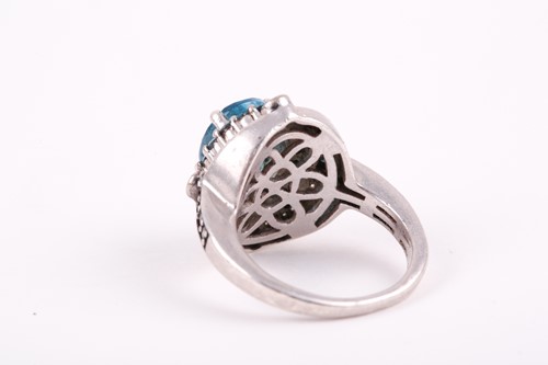 Lot 91 - A silver, topaz, and diamond ring, set with a...