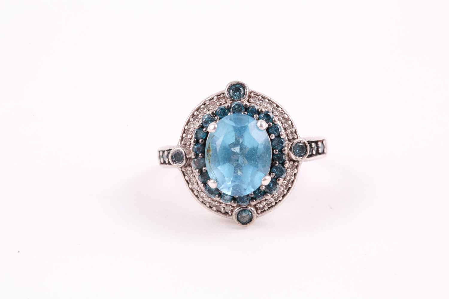 Lot 91 - A silver, topaz, and diamond ring, set with a...