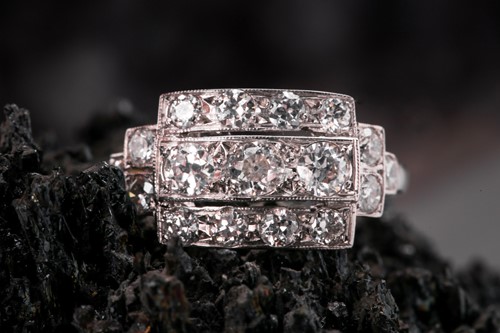 Lot 71 - A platinum and diamond ring, set with three...