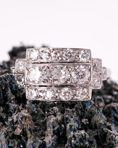 Lot 71 - A platinum and diamond ring, set with three...