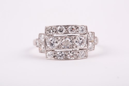 Lot 71 - A platinum and diamond ring, set with three...