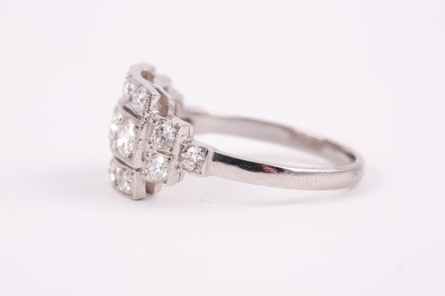 Lot 71 - A platinum and diamond ring, set with three...