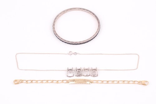 Lot 210 - A yellow metal identity bracelet, engraved...