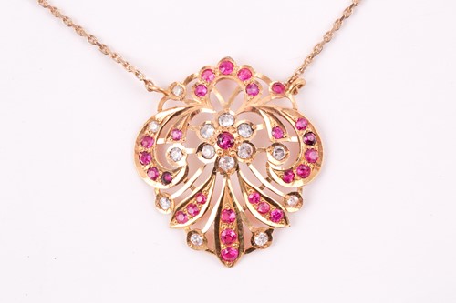 Lot 14 - An Indian yellow metal pendant, the openwork...