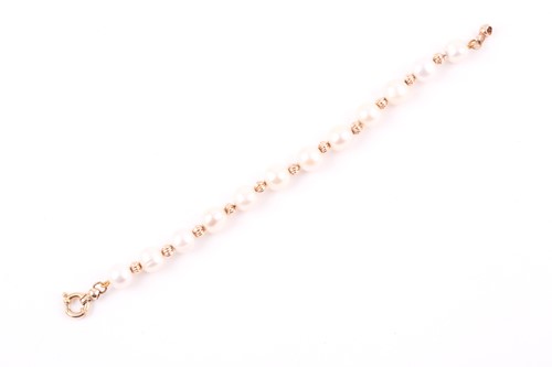 Lot 193 - A yellow metal and cultured pearl bracelet,...