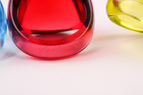 Lot 128 - A red glass Lalique bombe ring, engraved...