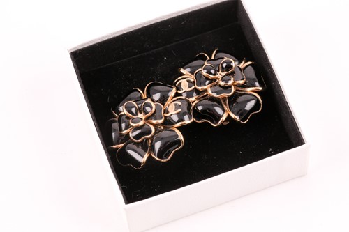 Lot 134 - Chanel. A pair of black Gripoix Camellia...