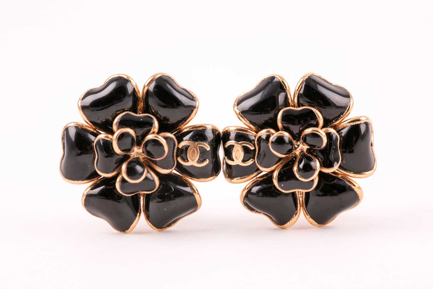 Lot 134 - Chanel. A pair of black Gripoix Camellia...