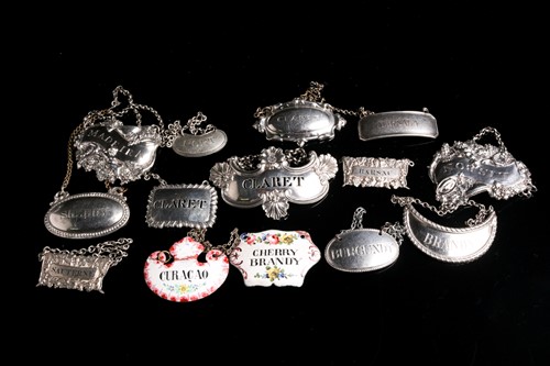 Lot 544 - A pair of George III silver wine labels,...