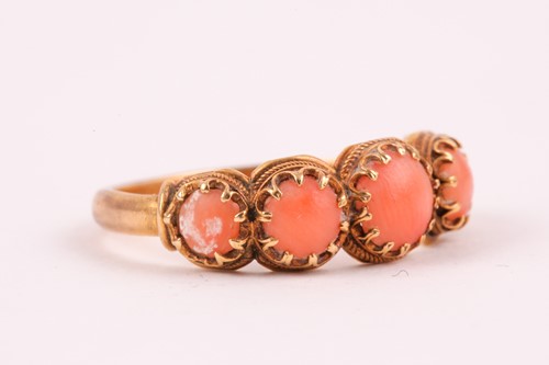 Lot 110 - A Georgian yellow gold and coral ring, set...