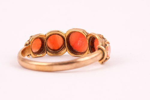 Lot 110 - A Georgian yellow gold and coral ring, set...