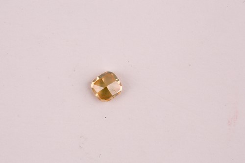 Lot 101 - A loose cushion-cut diamond, light orange,...