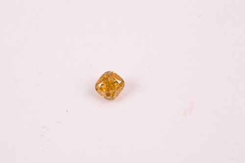Lot 101 - A loose cushion-cut diamond, light orange,...