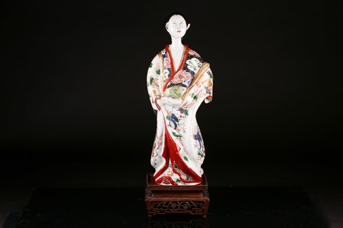 Lot 119 - A Japanese Edo period porcelain figure of a...