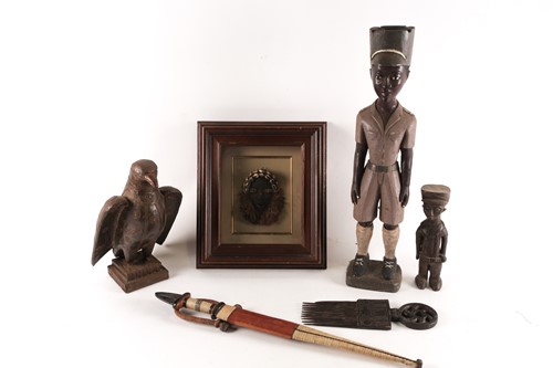 Lot 227 - An East African Askari figure, with peaked cap,...