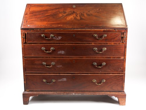Lot 274 - A George III mahogany bureau, the slope with...