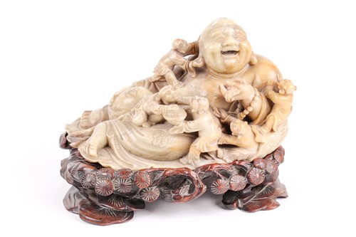 Lot 128 - A large Chinese carved green soapstone figure...